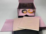 a box with a ring inside of it and a book inside of it