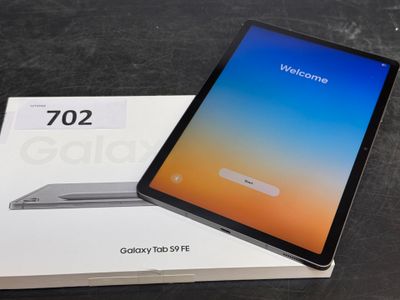 an open box of a tablet computer sitting on top of a table