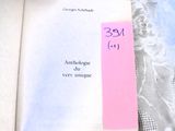 an open book with a pink sticker on it