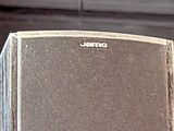 a cat that is sitting on top of a speaker