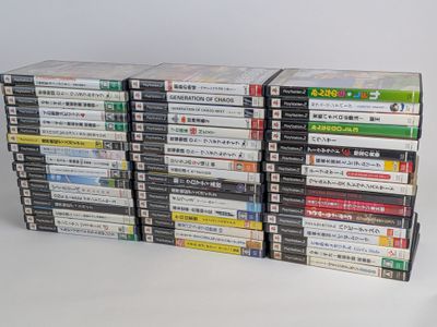 many dvds stacked on top of each other on a table