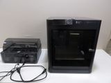 a picture of a printer and a printer case on a table