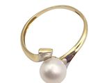 a close up of a pearl ring on a white background