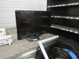 a television that is sitting on a shelf in a store