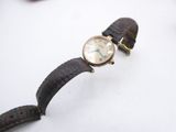 a wrist watch that is sitting on a table