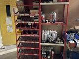 a red shelving with lots of items on top of it
