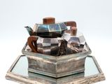 a silver box with a bunch of silver objects in it