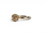 an image of a close up of a ring on a white surface