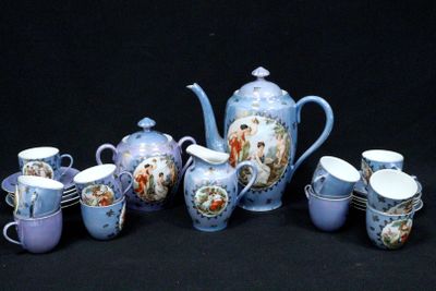 a group of blue and white teapots and cups