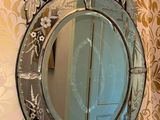 a mirror hanging on the wall in a bathroom