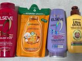 bottles of hair care products are lined up on a table