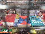 many books that are in a metal cage