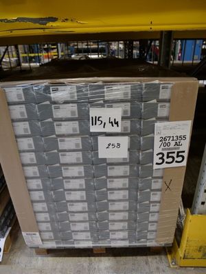 a pallet with a lot of boxes on it in a warehouse