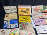 several different types of advertising cards are on a table