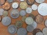 a lot of coins that are on the table
