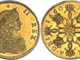 a gold sovereign coin with a cross on the front and a crown on the back
