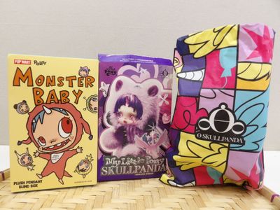 three books and a pillow on the table