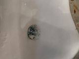 a close up of a toilet with a dirty seat