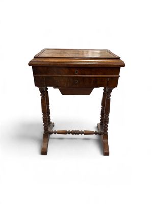 an old wooden table with a drawer on top of it