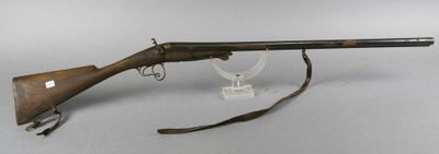 an old rifle with a wooden barrel on a white background