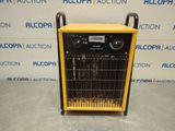 a yellow and black machine sitting on top of a table