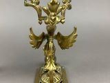 pair of brass candlesticks in the form of angels