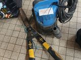 a pair of scissors and a pair of pliers on the floor