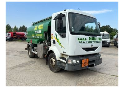 a picture of a garbage truck parked in a parking lot
