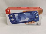 someone is holding a nintendo wii lite in their hand