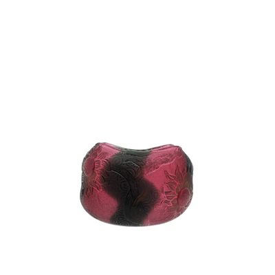 pink and black glass bead with a black and white design