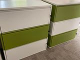 two green and white drawers next to each other