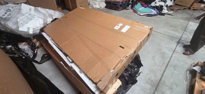 a large cardboard box sitting on top of a pile of boxes