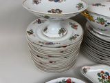 many plates and bowls stacked on top of each other