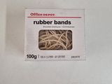 a box of rubber bands on a white surface