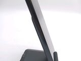 a cell phone that is on a stand on a table