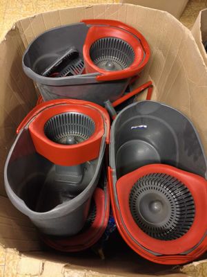four buckets in a cardboard box on the floor