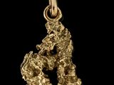 un pendentif en forme de pépite d'or sur fond noir