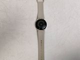 the back of a watch with a camera attached to the side of it