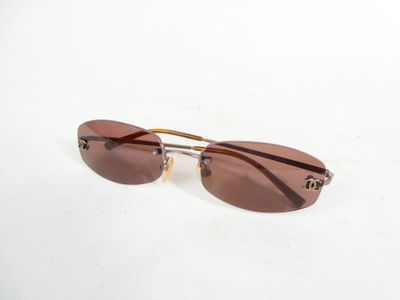 sunglasses on a white surface with a white background