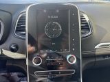 a car dashboard with a cell phone in the center of it