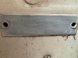 a close up of a metal plate on a wall