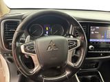 the interior of a car with a steering wheel and dashboard controls