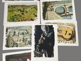several paintings of people and animals are displayed on a table