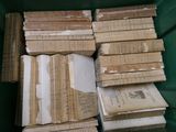 many old books stacked on top of each other