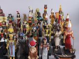 many figurines of different sizes and colors on display