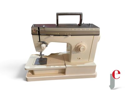 a sewing machine that is sitting on top of a table