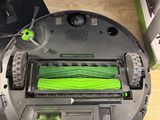 someone is using a vacuum cleaner to clean the floor of a room