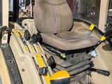 an image of a tractor with a seat on it ' s back