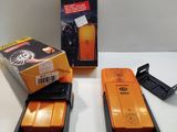 two orange phones sitting next to each other on a table