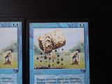 two cards with pictures of people in a field